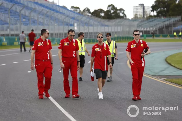 Sebastian Vettel, Ferrari walks the track with members of his team