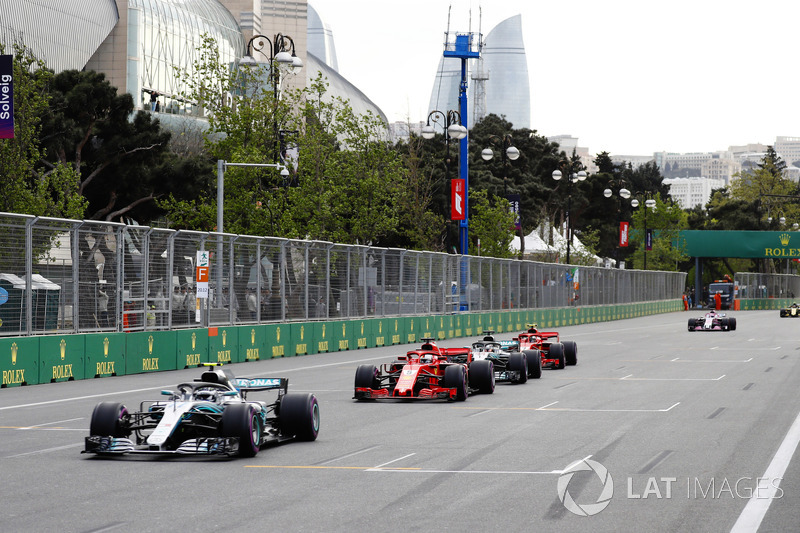 Valtteri Bottas, Mercedes AMG F1 W09, leads Sebastian Vettel, Ferrari SF71H, Lewis Hamilton, Mercedes AMG F1 W09, and Kimi Raikkonen, Ferrari SF71H at the restart