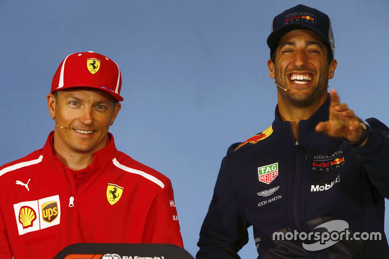 Kimi Raikkonen, Ferrari, and Daniel Ricciardo, Red Bull Racing, share a joke in the Thursday press conference