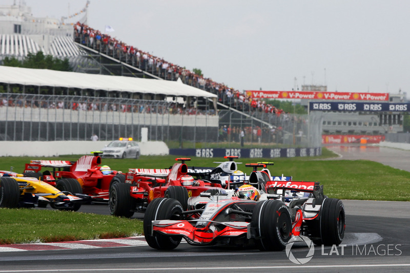 Lewis Hamilton, McLaren MP4/23 leads at the start of the race