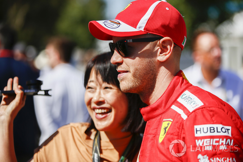 Sebastian Vettel, Ferrari, has his photo taken with a fan