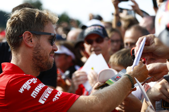 Sebastian Vettel, Ferrari, signs autographs for fans
