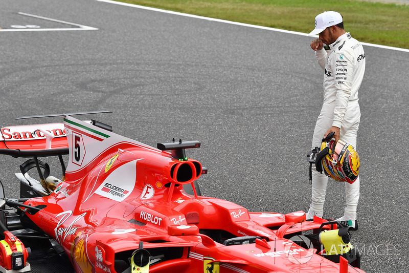 Lewis Hamilton, Mercedes AMG F1 looks at the Ferrari SF70H in parc ferme