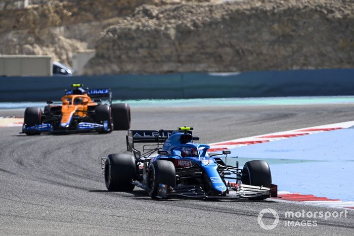 Esteban Ocon, Alpine A521 and Lando Norris, McLaren MCL35M 