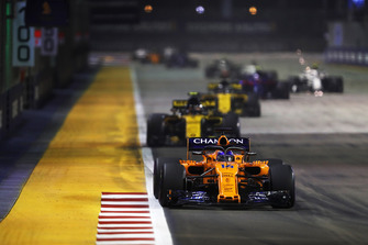 Fernando Alonso, McLaren MCL33, leads Carlos Sainz Jr., Renault Sport F1 Team R.S. 18, and Nico Hulkenberg, Renault Sport F1 Team R.S. 18