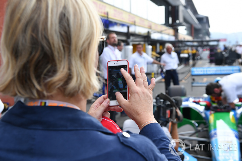 Sabine Kehm, takes a photo of Mick Schumacher, Benetton B194