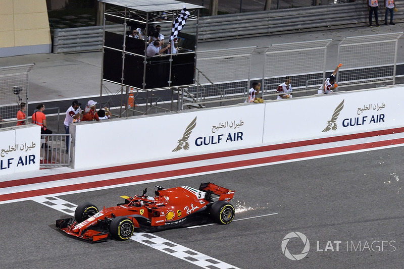 Race winner Sebastian Vettel, Ferrari SF71H crosses the line and takes the chequered flag