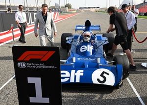 Sir Jackie Stewart drives his Tyrrell 006 
