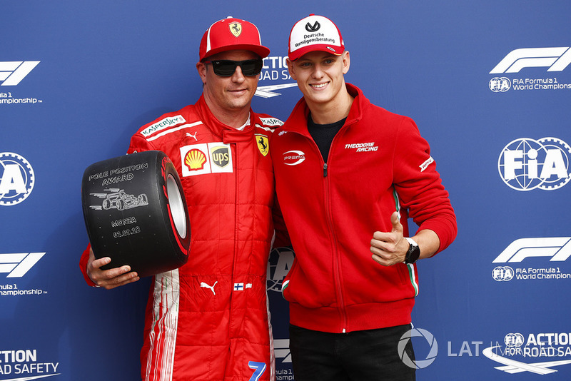 Polesitter Kimi Raikkonen, Ferrari, with Mick Schumacher