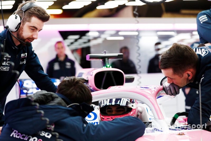 Lance Stroll, Racing Point RP19, talks to the team in the garage
