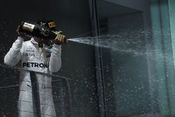 Race winner Lewis Hamilton, Mercedes AMG F1 celebrates on the podium, the champagne