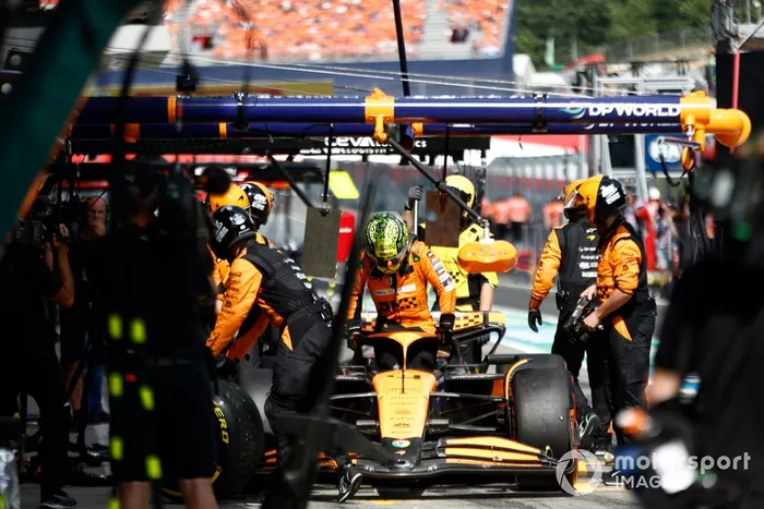 Lando Norris, McLaren MCL38, retires in the pit lane after contact with Max Verstappen, Red Bull Racing RB20, whilst battling for the lead