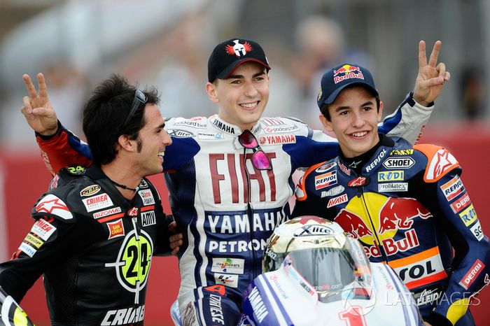 Toni Elias, Jorge Lorenzo y Marc Márquez, campeones del mundo de Moto2, MotoGP y 125cc, respectivamente, en 2010.