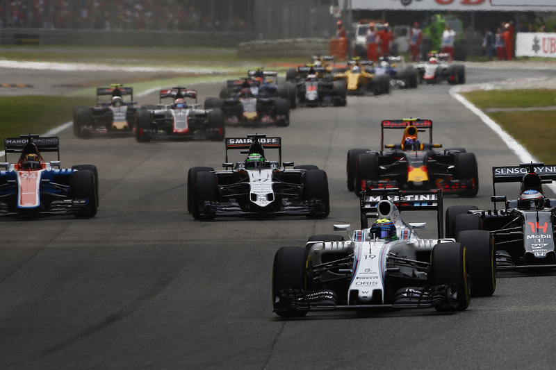 Felipe Massa, Williams FW38 Mercedes, leads Fernando Alonso, McLaren MP4-31 Honda; Nico Hulkenberg, 