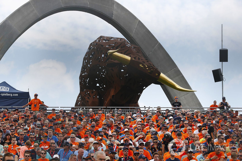 Dutchs fans in a grandstand beneath a sculpture of a bull