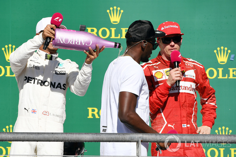 Race winner Lewis Hamilton, Mercedes AMG F1 celebrates on the podium with the champagne and Usain Bolt, Kimi Raikkonen, Ferrari