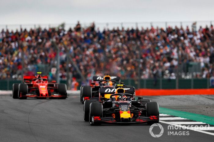 Pierre Gasly, Red Bull Racing RB15, leads Max Verstappen, Red Bull Racing RB15, and Charles Leclerc, Ferrari SF90