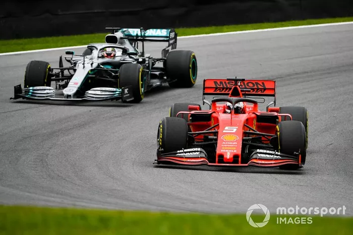 Sebastian Vettel, Ferrari SF90 and Lewis Hamilton, Mercedes AMG F1 W10