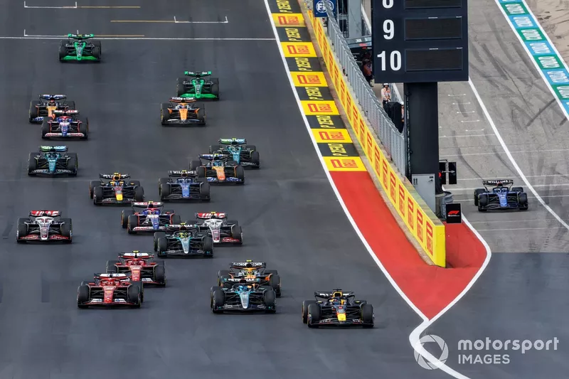 Max Verstappen, Red Bull Racing RB20, George Russell, Mercedes F1 W15, Charles Leclerc, Ferrari SF-24, Lando Norris, McLaren MCL38, Carlos Sainz, Ferrari SF-24, Kevin Magnussen, Haas VF-24, the rest of the field at the start of the Sprint race