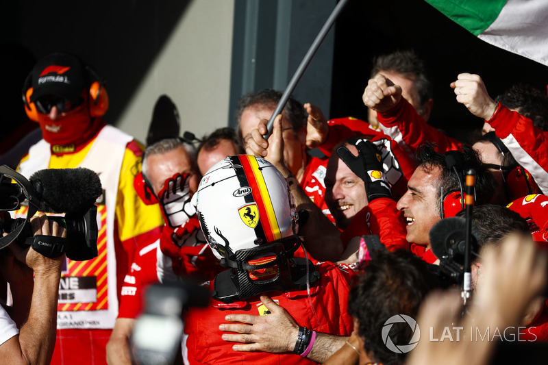 Race winner Sebastian Vettel, Ferrari, celebrates on arrival in Parc Ferme with his team