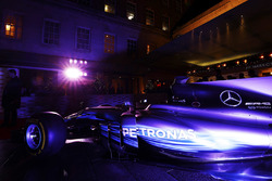 A Mercedes F1 car next to the entrance