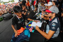 Carlos Sainz Jr., Scuderia Toro Rosso signs autographs for the fans