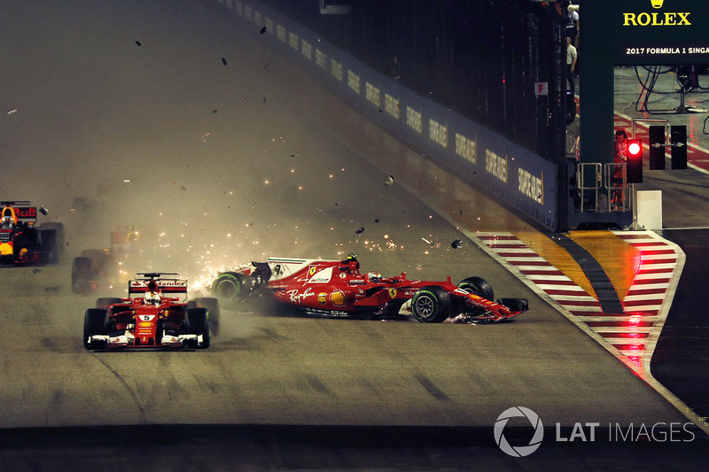 Sebastian Vettel, Ferrari SF70H leads at the start of the race and the cars of Kimi Raikkonen, Ferrari SF70H and Max Verstappen, Red Bull Racing RB13 crash after colliding