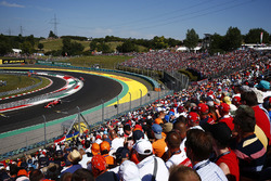 Fans watch Sebastian Vettel, Ferrari SF70H, lead Kimi Raikkonen, Ferrari SF70H