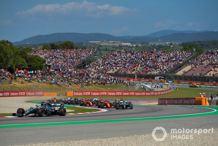 Lewis Hamilton, Mercedes AMG F1 W10, leads Valtteri Bottas, Mercedes AMG W10, Sebastian Vettel, Ferrari SF90, Max Verstappen, Red Bull Racing RB15, and the rest of the field at the start