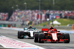 Kimi Raikkonen, Ferrari SF71H, leads Valtteri Bottas, Mercedes AMG F1 W09