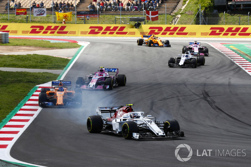 Charles Leclerc, Sauber C37, Fernando Alonso, McLaren MCL33 and Esteban Ocon, Force India VJM11