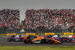 Fernando Alonso, McLaren MCL32 battles with Brendon Hartley, Scuderia Toro Rosso STR12 and Pierre Ga