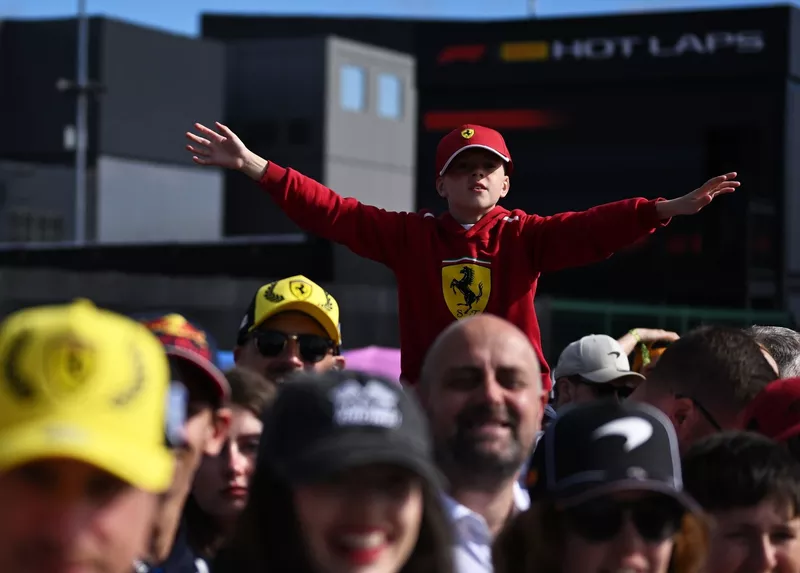 A young fan shows support for Scuderia Ferrari