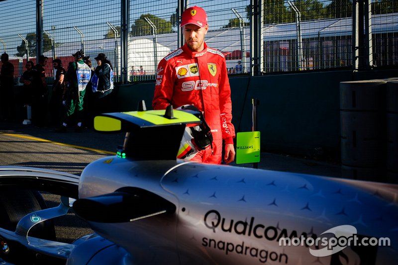 Sebastian Vettel, Ferrari looks on the Mercedes AMG F1 W10