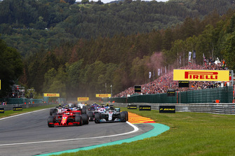 Sebastian Vettel, Ferrari SF71H, leads Lewis Hamilton, Mercedes AMG F1 W09, Sergio Perez, Racing Point Force India VJM11, and Esteban Ocon, Racing Point Force India VJM11, at the start