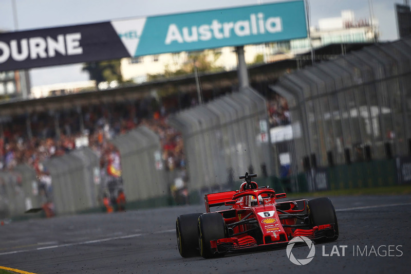 Sebastian Vettel, Ferrari SF71H, takes the chequered flag for victory