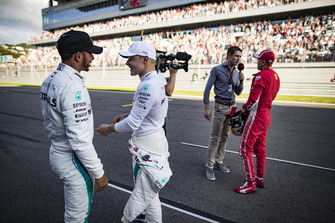Lewis Hamilton, Mercedes AMG F1, congratulates his team mate Valtteri Bottas, Mercedes AMG F1