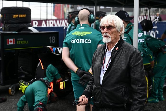 Bernie Ecclestone looks on on the grid