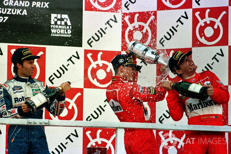 Podium: Michael Schumacher, Ferrari, Heinz-Harald Frentzen, Williams Renault, Eddie Irvine, Ferrari