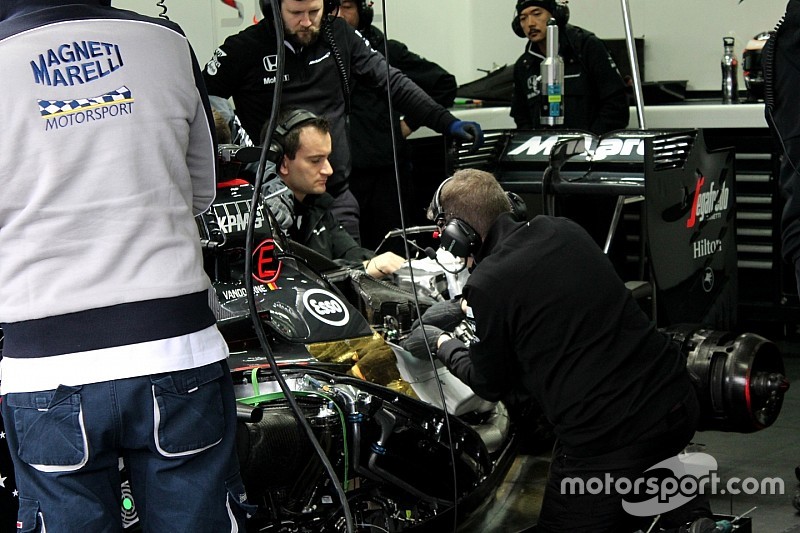 Mechanics work on Stoffel Vandoorne's McLaren