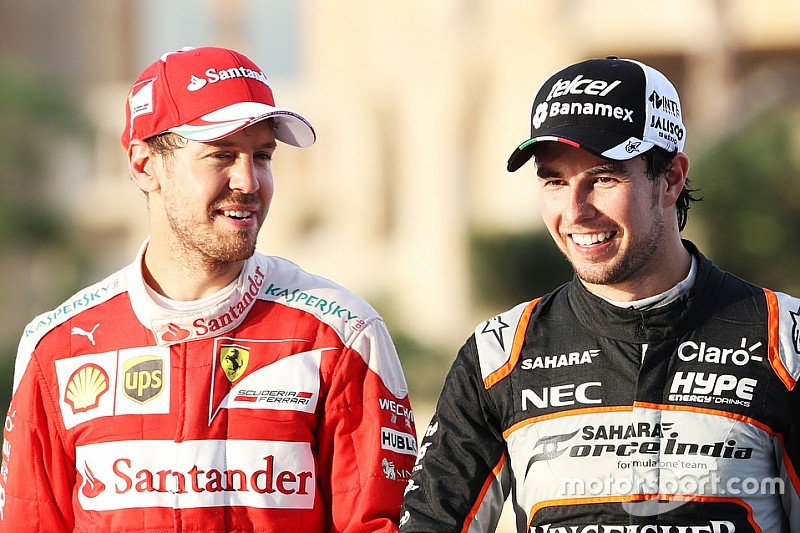 (L to R): Sebastian Vettel, Ferrari with Sergio Perez, Sahara Force India F1