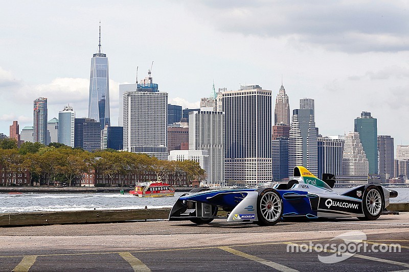 A Formula E car with the New York City skyline