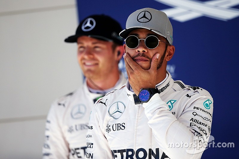Pole sitter Lewis Hamilton, Mercedes AMG F1 in parc ferme with team mate Nico Rosberg, Mercedes AMG 