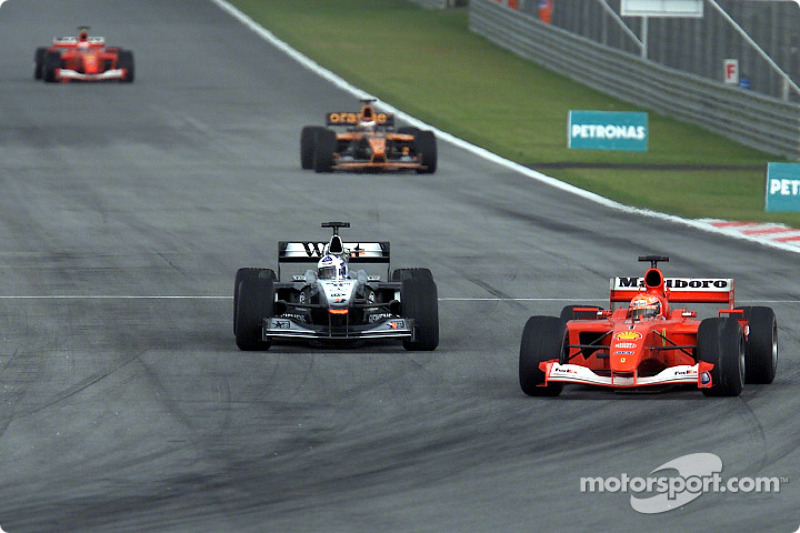 Michael Schumacher passing David Coulthard for first position