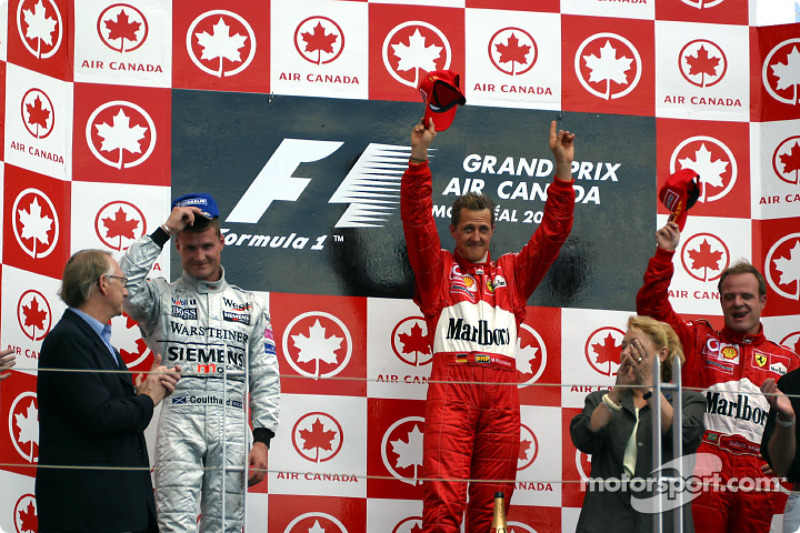 The podium: race winner Michael Schumacher with David Coulthard and Rubens Barrichello