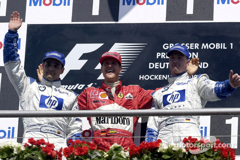 The podium: race winner Michael Schumacher with Juan Pablo Montoya and Ralf Schumacher