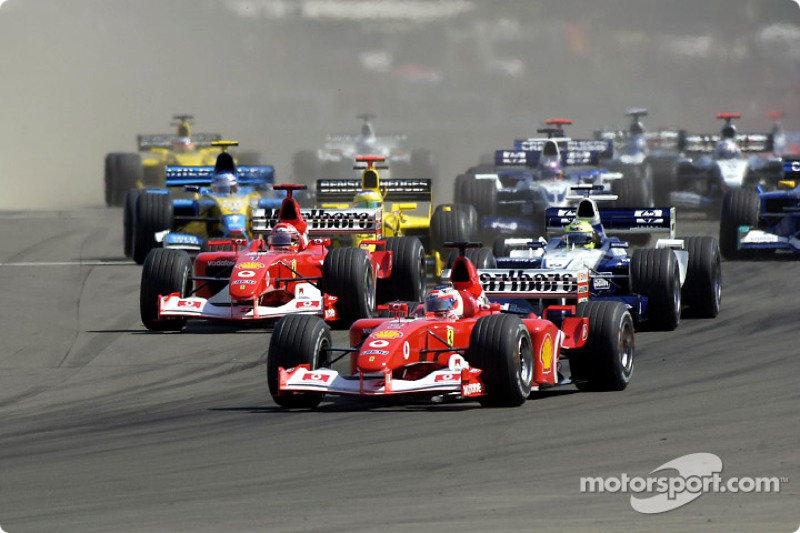 First corner: Rubens Barrichello leading Michael Schumacher and Ralf Schumacher