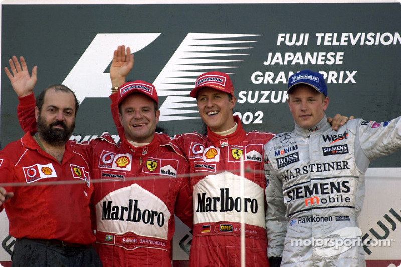 The podium: race winner Michael Schumacher with Rubens Barrichello and Kimi Raikkonen