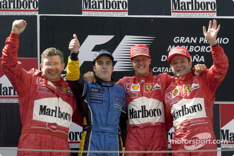 The podium: race winner Michael Schumacher with Ross Brawn, Fernando Alonso and Rubens Barrichello