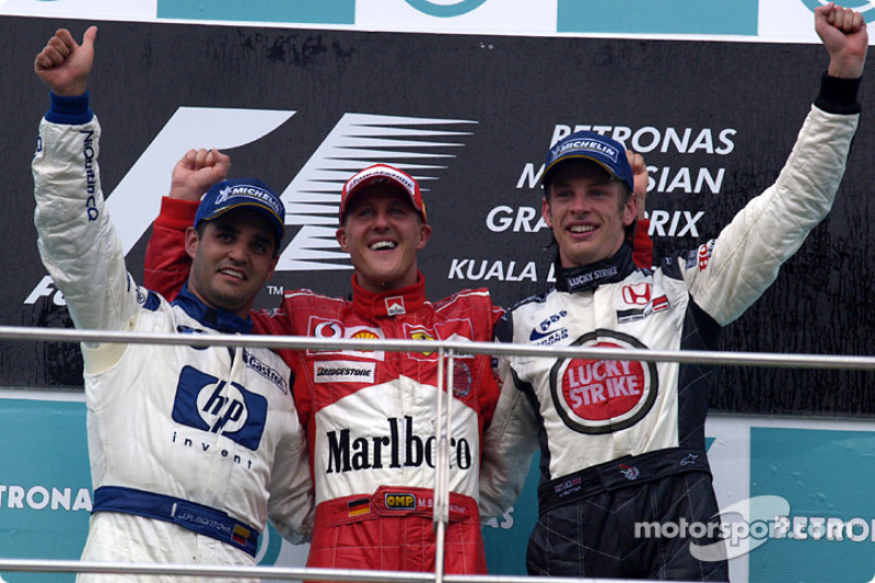 Podium: race winner Michael Schumacher with Juan Pablo Montoya and Jenson Button